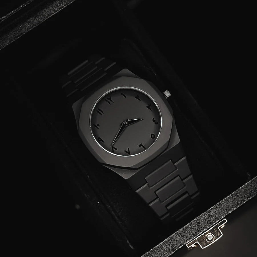 Black wristwatch in a dark box