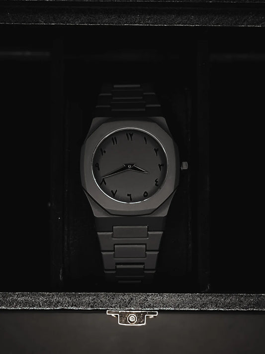 Black wristwatch in a dark box